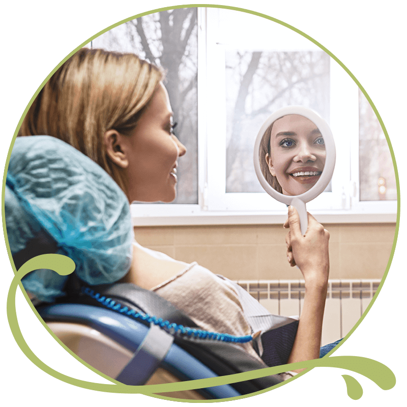 cosmetic dental patient holding mirror