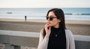 Woman standing next to beach holding jaw